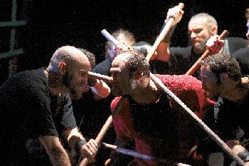 Armand Sindoni as The Mullah (left) and Irakli Kavsadze as Zviadauri